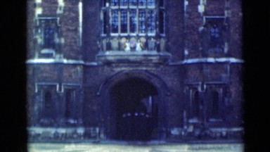 1946: Group of People Entering Tall Medieval-Style Structure in London