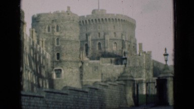 1946: Old Wrought Iron Gated Stone and Brick Castle on Top of Hill