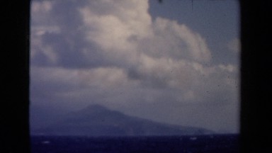 1946: mountain during nice, cloudy day overseeing lake NETHERLANDS