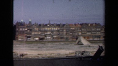 1946: there are some more buildings in town under blue sky. NETHERLANDS