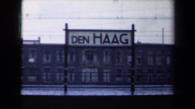 1946: large sign outside cold, drab building that says den haag NETHERLANDS