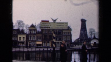 1946: People Standing and Walking Near Water in the Netherlands