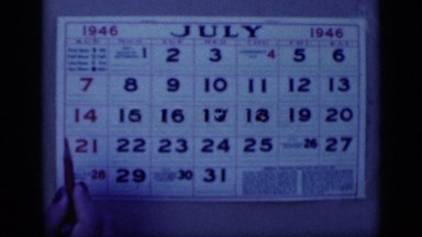 1946: Close-Up of Hand Marking July 8th on Calendar in Egypt