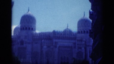 1946: panning view of palace with large steeple and very ornate dome. EGYPT