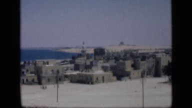 1946: stone like structures along what appears to be coast with hills