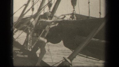 1944: man is to ready to sail to travel in beach, enjoying his traveling.