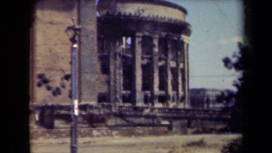 1944: some old buildings with people in city at morning time. MANILLA