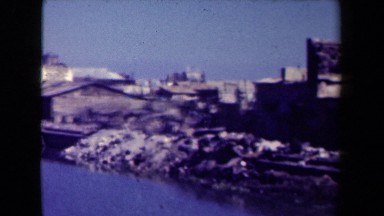 1944: Destroyed Buildings and Rubble Line Banks of Canal in Manila