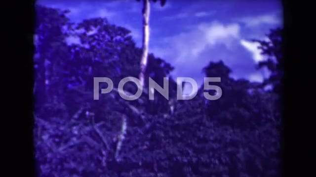 1944: Beautiful Scene of Clouds Hovering Over Hilly Range Next to River