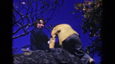 1943: two women climbing to top of large boulder. SKYLINE DRIVE VIRGINIA