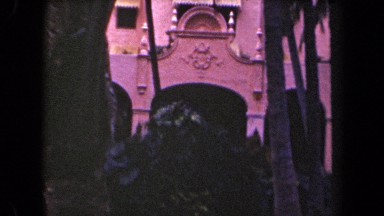 1944: pink palace of king ways, pink building with huge trees good location spot