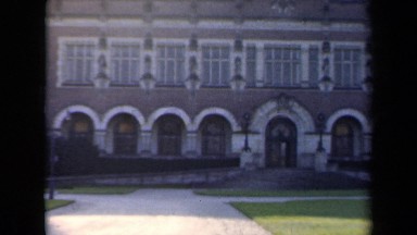 1946: very big building with lots of windows and garden in front at daytime