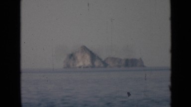 1947: tall rocks on island in middle of ocean PERSIAN GULF