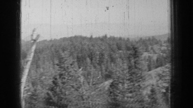 1937: mountaintop view of forested range BEND OREGON