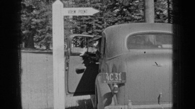 1937: shot of lady coming out of car BEND OREGON