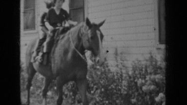 1937: two girls are riding on horse and one girl