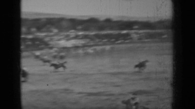 1937: horse race competition with powerful riders controlling energetic horses.