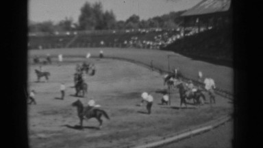 1937: horse is went mad in race course, people are running away from its path.