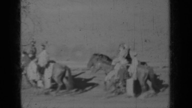1937: people on horseback representing america trotting down dirt track KLAMATH