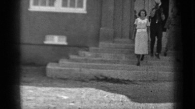 1937: People Coming Down Stairs from Building at Daytime Klamath California