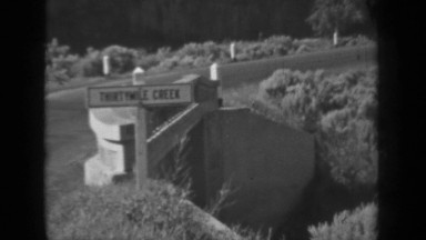 1937: an area with road, bridge etc under valley of mountain range KLAMATH