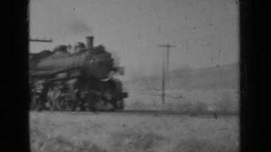 1937: train speeds down track at daytime KLAMATH CALIFORNIA