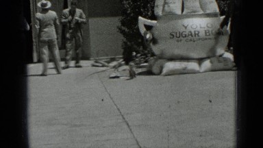 1937: two persons talking side to statue of park during morning SAN FRANCISCO