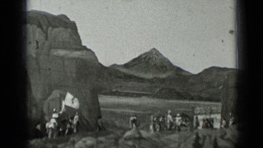 1937: some people are protesting, leader is having flag in his hand