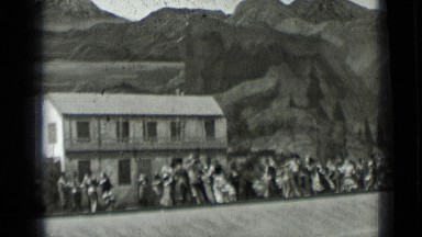 1937: actor and actress are running to left of screen