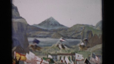 1937: lots of people riding horse with flag in hands of different countries