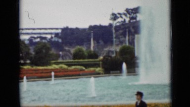 1937: the people were walking on road with beautiful waterfalls SAN FRANCISCO