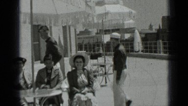 1937: the people were sitting,clapping, jumping under umbrella SAN FRANCISCO