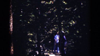 1938: group of people walking through forest near waterfall COLORADO