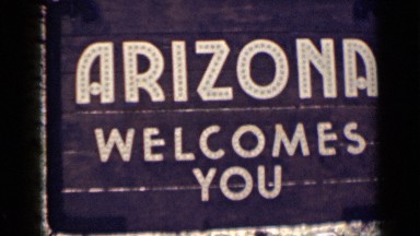 1939: board of sign it represents welcome to city or hotel or place ARIZONA