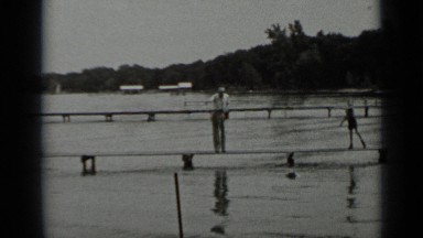 1939: two old women walking on man made bridge CLEAR LAKE CALIFORNIA