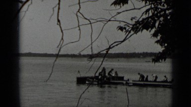 1939: party of men docking their canoes on lake dock. CLEAR LAKE CALIFORNIA