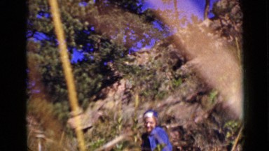 1939: the woman was standing and place consists of trees, plants COLORADO