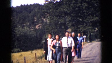 1939: group of people walking on road on hill station and enjoying themselves