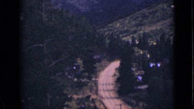 1939: very beautiful view of road and mountain both side of road with trees