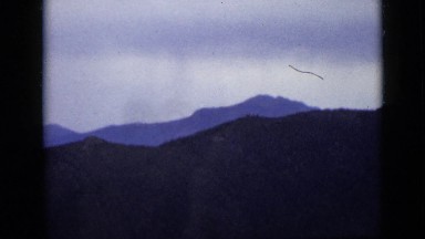 1939: colorado mountain with skyline horizon and road alongside going uphill