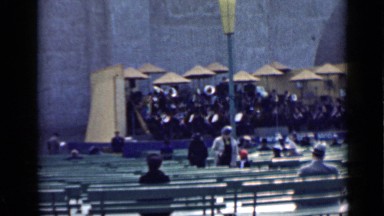 1939: woman and child walking through nearly empty amphitheater