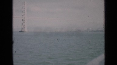 1939: Distant Shot of Large Suspension Bridge and Skyline San Francisco