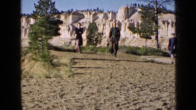 1939: three people are walking at forest and see nature at morning time. UTAH