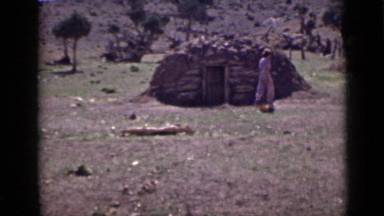 1939: woman steps forward and hesitates, steps back and reflects on hilly