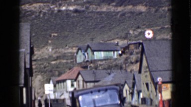 1939: small village on valley of mountain with coniferous trees UTAH