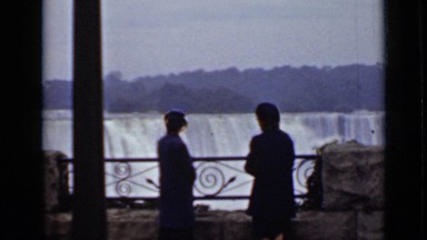 1940: two women peer over niagara falls CANADA