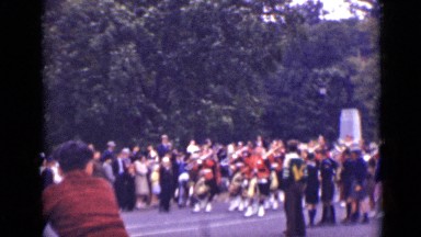 1940: peoples in place going parade with same uniform dresses. CANADA