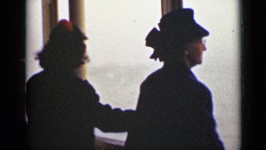 1940: granny and granddaughter in cruise watching deep ocean