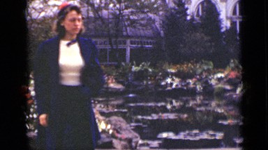 1940: woman walking in garden. CANADA