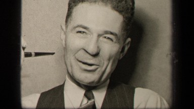 1942: man talking to camera and laughing while holding pipe SEBRING OHIO